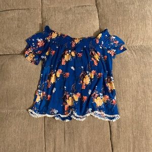 Blue flower off shoulder